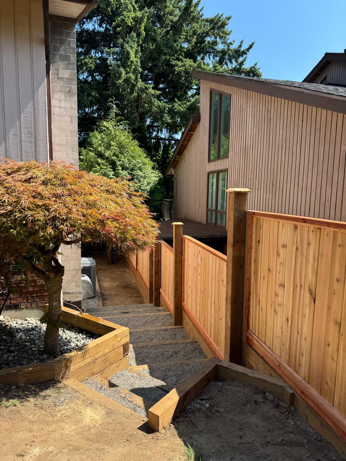 Finished cedar fence beside a residential home